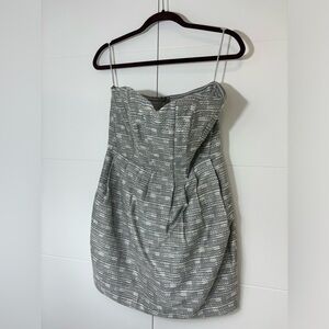 Silver/grey strapless Greylin party dress with pockets.